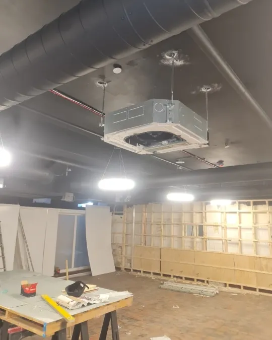 a room with a lot of unfinished walls and lights